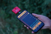 IPhone with a red alert block attached to detect bats
