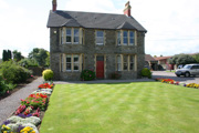 Highdale B&B in front of a lawn