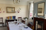A dining room with a large dining table