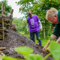 Ripple Effect staff member and Noah's Ark Zoo Farm staff member plant pumpkins in a key hole garden. 